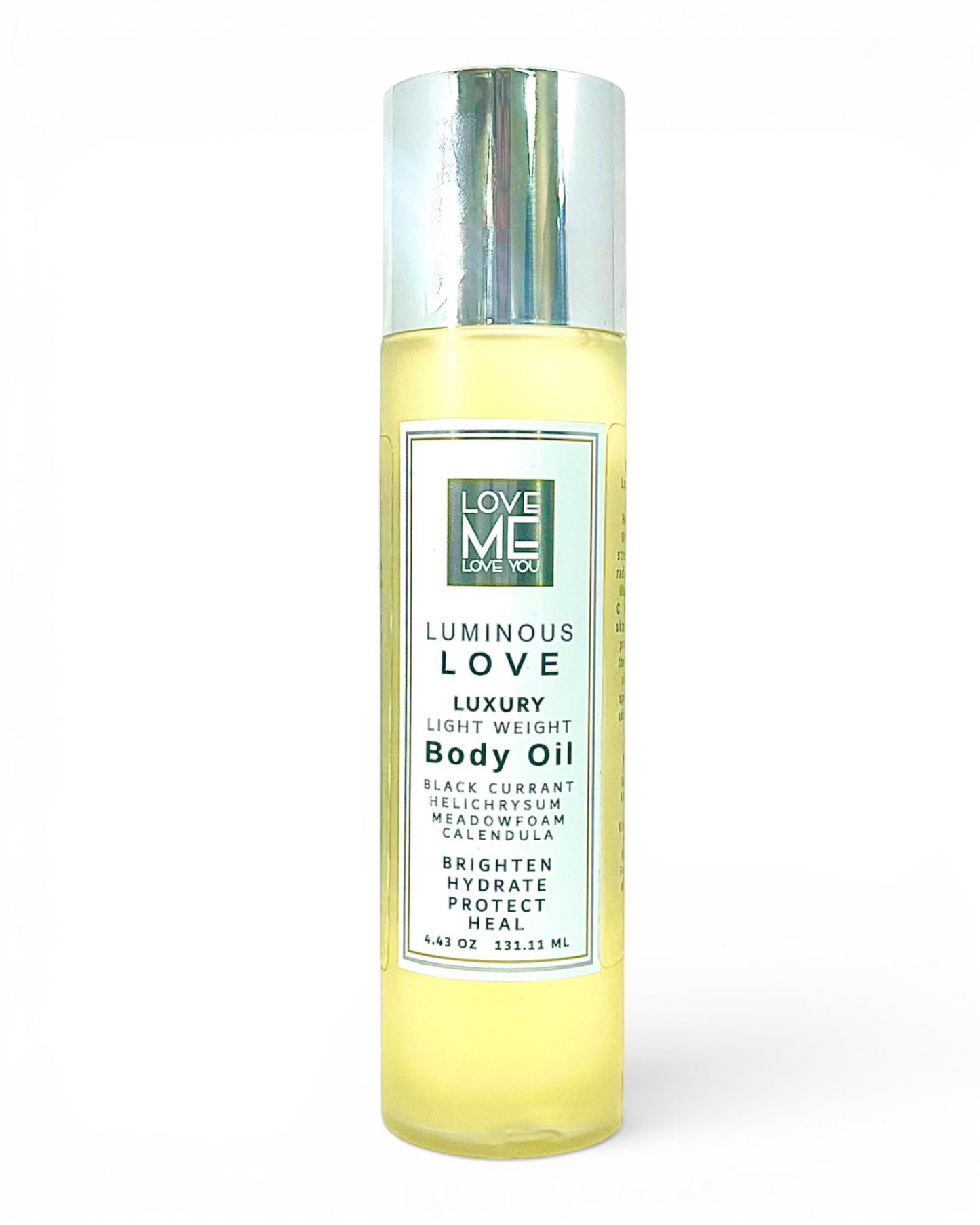 Luminous Love body oil bottle with metallic cap, clear label and yellow oil