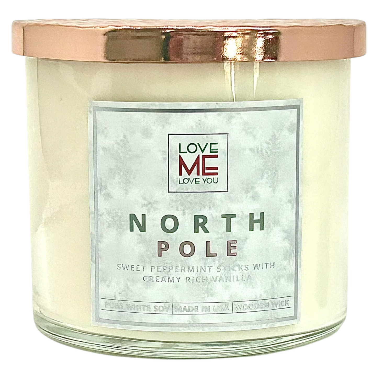 Cream wood-wick candle in clear glass jar with silver lid and NORTH POLE label