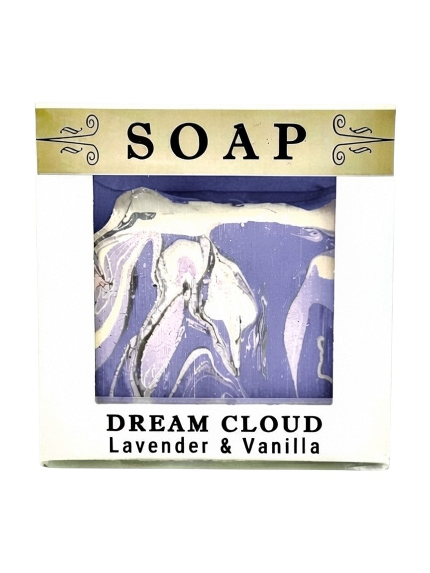 A packaged bar of soap labeled 'SOAP' and 'DREAM CLOUD Lavender & Vanilla' with a lavender and white marbled soap visible through a clear window on a white box.