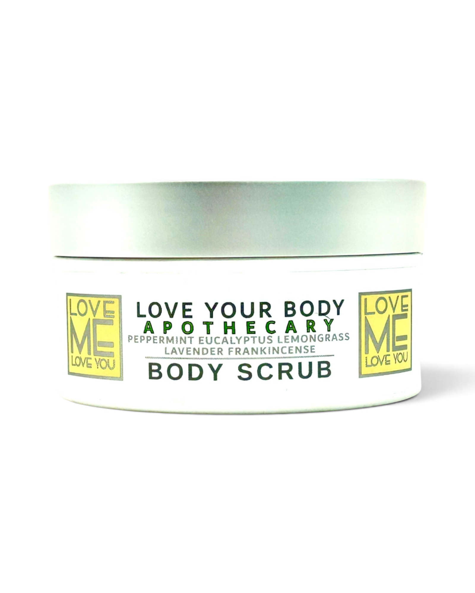A white jar of Love Your Body Apothecary body scrub scented with lavender, eucalyptus, frankincense, lemongrass and peppermint with a silver lid, featuring green and yellow text on a white background.