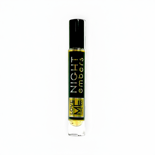Clear eau de parfum spray bottle with black cap and gold label