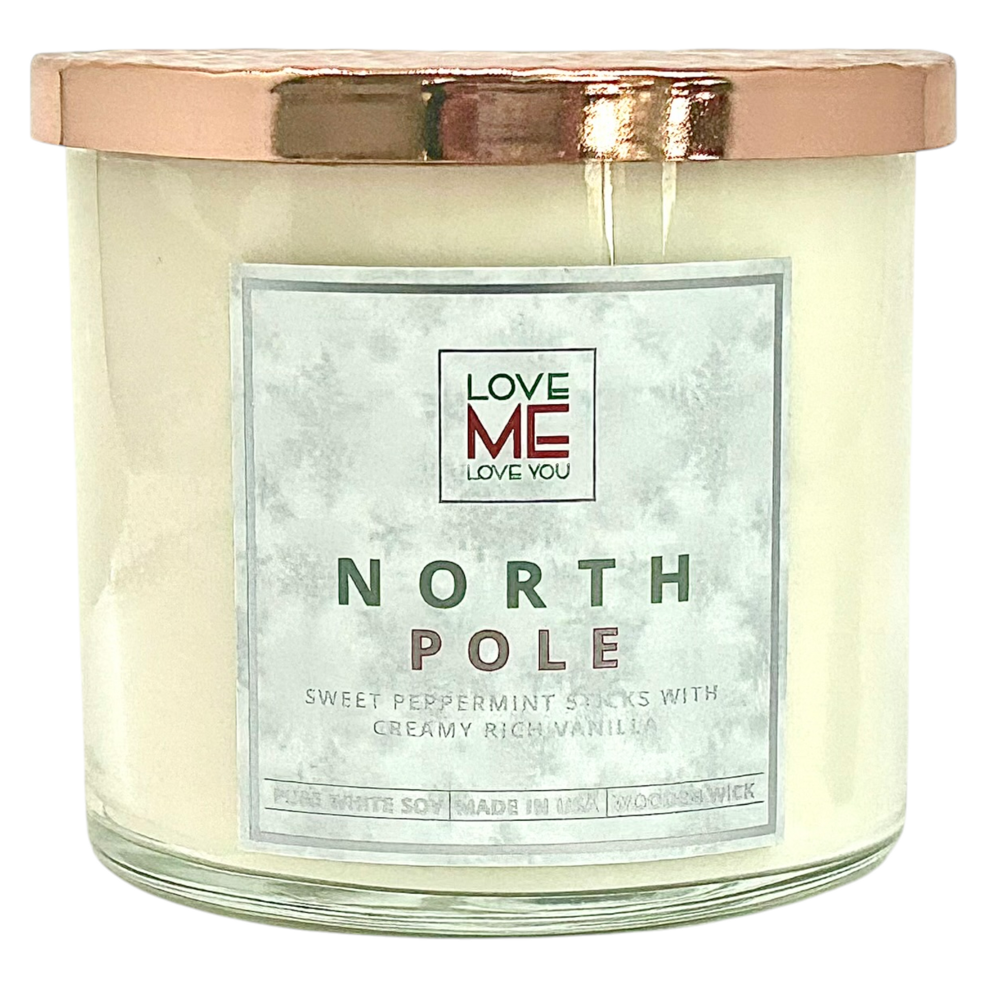 Cream wood-wick candle in clear glass jar with silver lid and NORTH POLE label