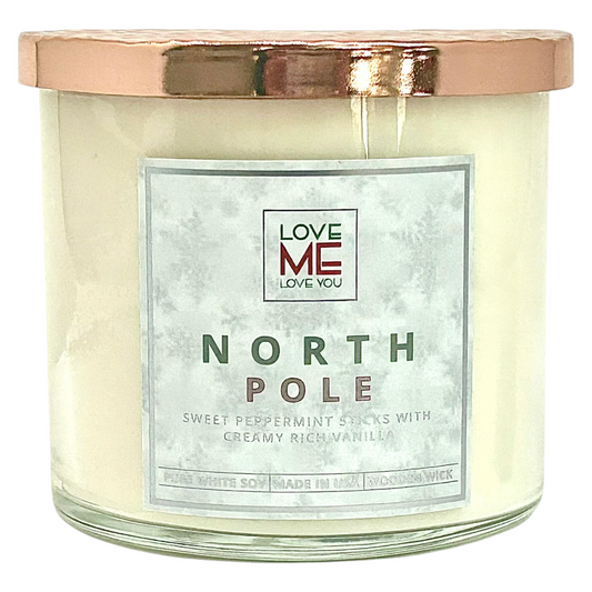 Cream wood-wick candle in clear glass jar with silver lid and NORTH POLE label