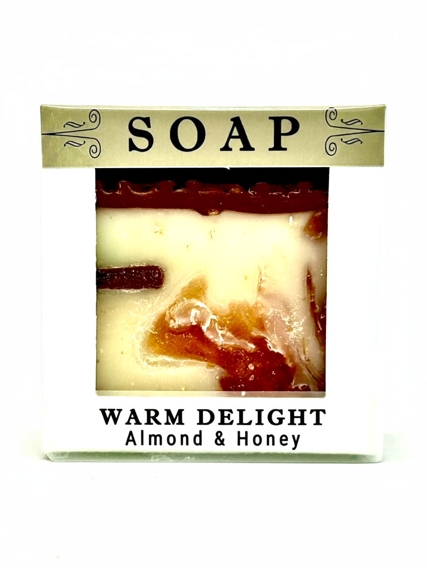 A packaged bar of soap labeled 'SOAP' and 'WARM DELIGHT Almond & Honey' on a plain white background.