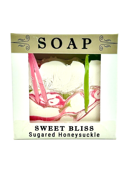 Sweet Bliss Sugared Honeysuckle soap in a white box with a clear window showing the marbled pink and green soap, and a gold header that reads 'SOAP'.