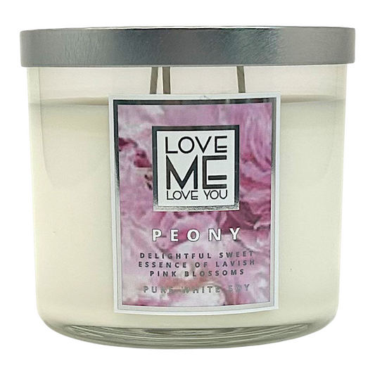 Peony scented candle in a frosted glass jar with purple pink label, dark gray lid