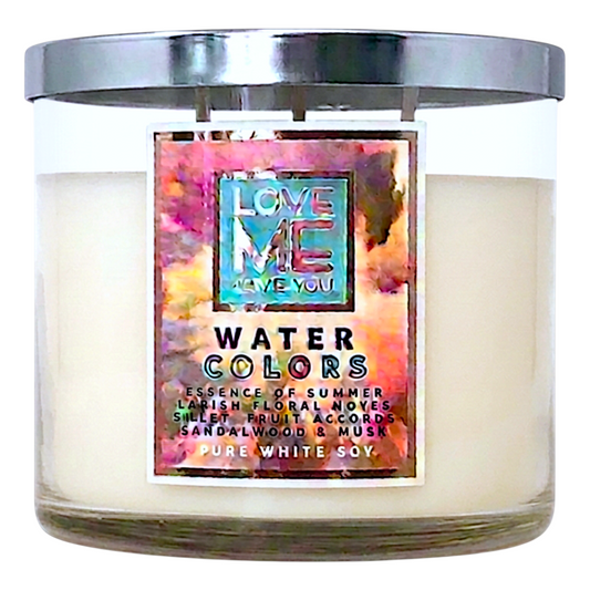 Water Colors scented candle in a clear glass jar with colorful label and metallic lid